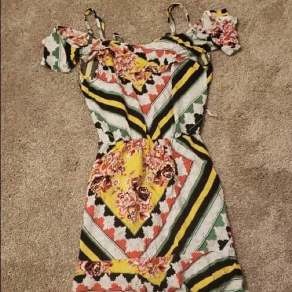 Beautiful Dress with unique designs. Perfect for summer cookouts.